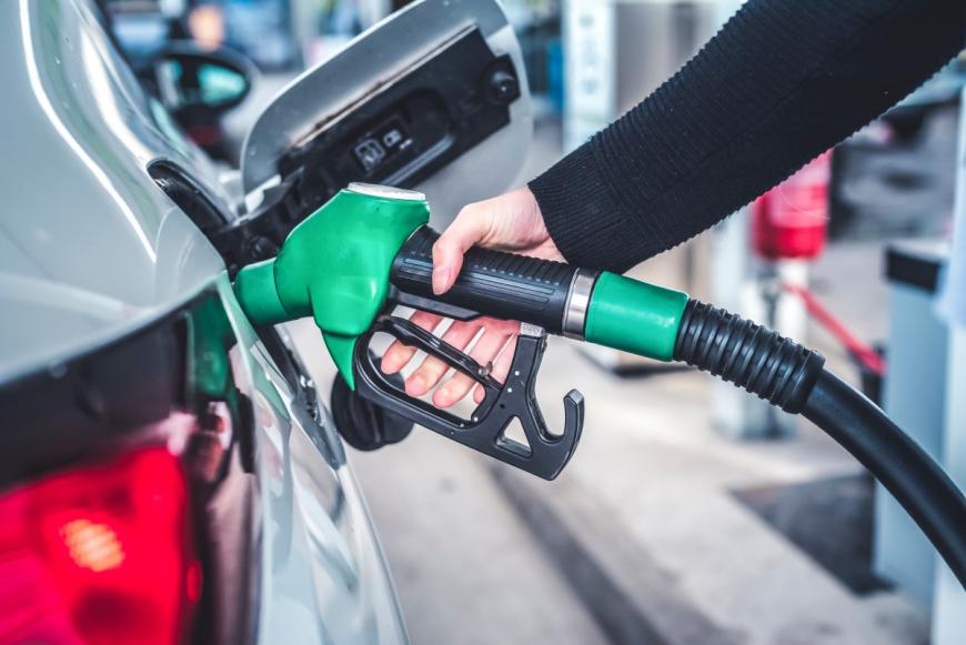 Woman pumping gas