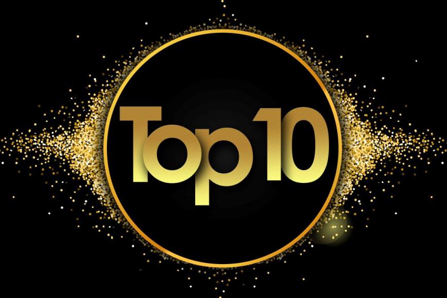 The words Top 10 in bold, gold type overlaid on a black circle with a gold ring around it. Gold stars surround the circle. The background behind the circle is black.