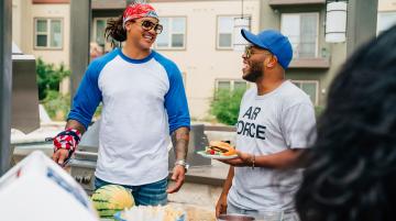 Two friends at a barbeque